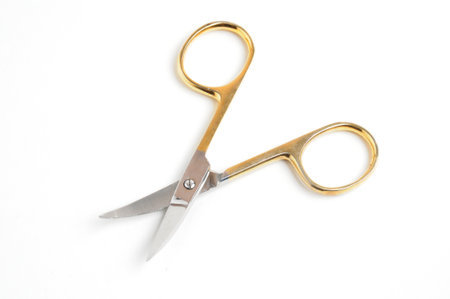 Pedicure scissors for cutting nails on isolated white backgroundの写真素材