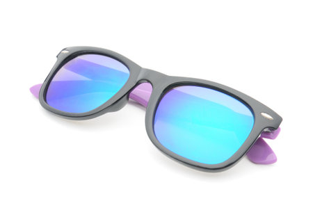 Elegant sunglasses in dark purple colored glasses on an isolated white background