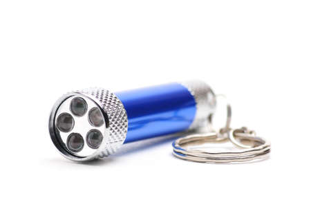 Blue LED flashlight with the ability to recharge from the mains on an isolated white background