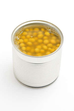 Metal tin can with green peas on isolated white backgroundの写真素材