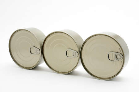 Metal cans of ready-made food in canned form on isolated white background