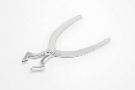 Metal sugar cutters on isolated white backgroundの写真素材