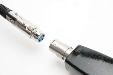 Audio cable with XLR connectors for microphones and professional audio equipment on isolated white backgroundの写真素材
