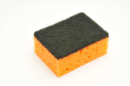 Sponge for washing dishes and plumbing on an isolated white backgroundの写真素材
