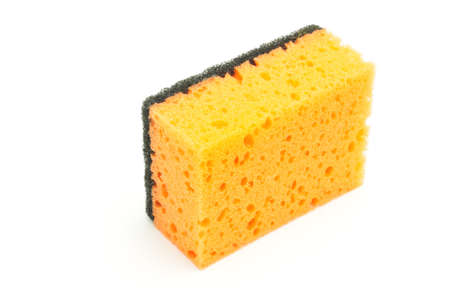 Sponge for washing dishes and plumbing on an isolated white backgroundの写真素材