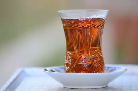 Drinking tea with a glass of tea outdoorsの写真素材