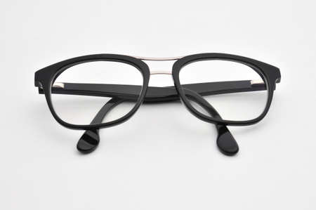 Transparent optical glasses on an isolated white background.