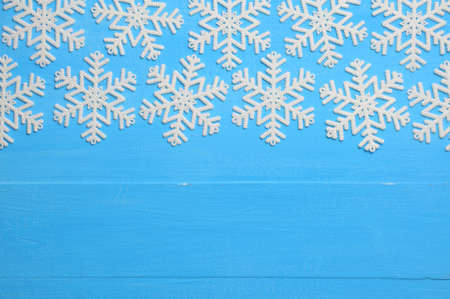 Christmas blue background with snowflakes for New Years holidayの写真素材