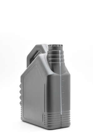 Black car engine oil container and engine oil filter isolated on white backgroundの写真素材