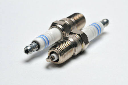 Spark plug for cars with a gasoline engine on an isolated white background