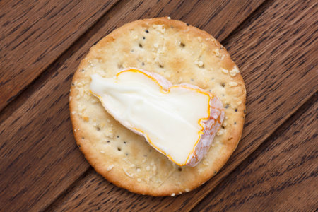 Crispy round cheese cracker from above. With cheese.の写真素材