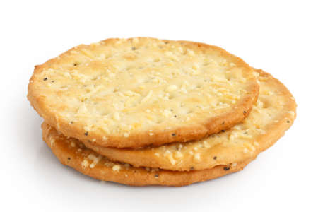 Three golden cheese crackers on white.の写真素材