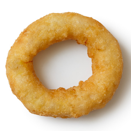 Single deep fried onion or calamari ring isolated from above.の写真素材