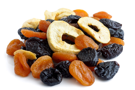 Pile of mixed dried fruit isolated on white. In perspective.の写真素材