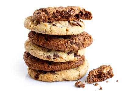Stack of light and dark chocolate chip cookies isolated. One half with crumbs.