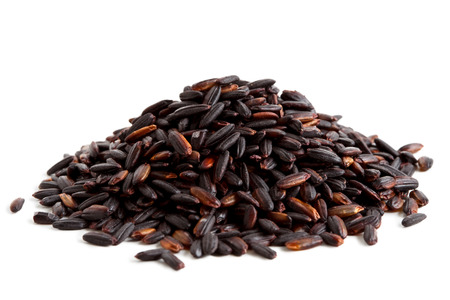 Pile of Nerone black long grain rice isolated on white.の写真素材