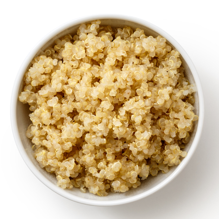 Cooked quinoa in white ceramic bowl isolated on white from above.の写真素材