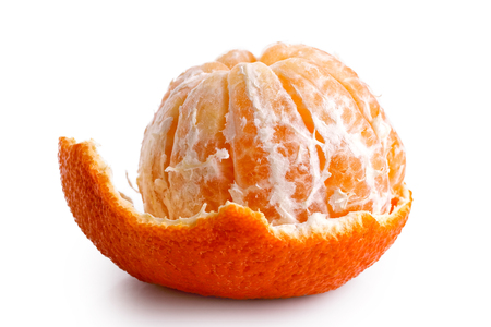A half peeled mandarin isolated on white.の写真素材