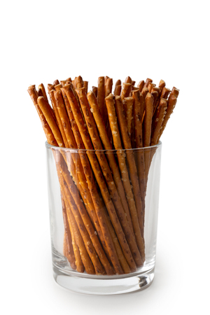 Crunchy salty pretzel sticks in glass isolated on white.の写真素材