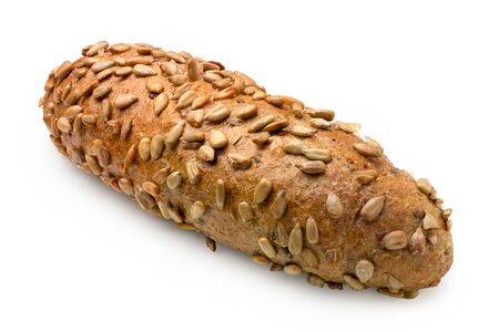 Long whole wheat bread roll with sunflower seeds isolated on white.の写真素材