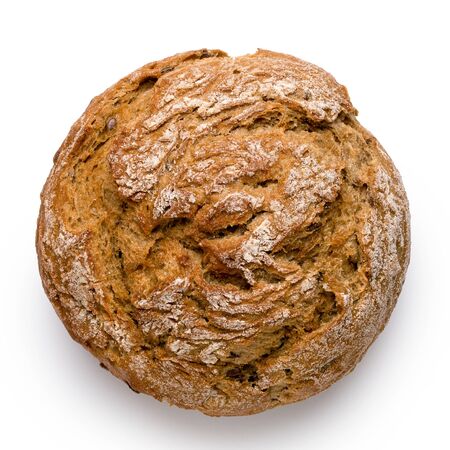 Round rustic whole wheat bread roll isolated on white. Top view.の写真素材