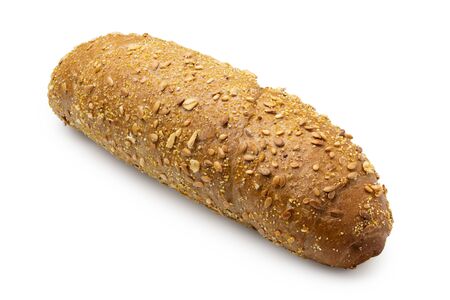 Long whole wheat bread roll with sesame seeds isolated on white.の写真素材