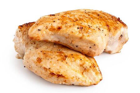 Two whole pan roasted chicken breasts isolated on white.の写真素材