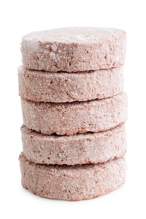 Stack of frozen plant based burger patties isolated on white.の写真素材