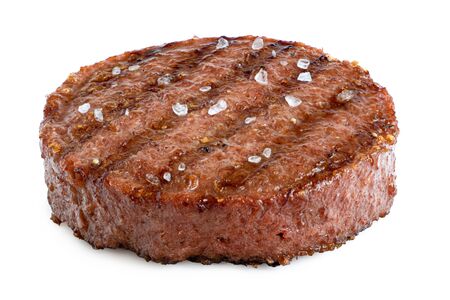 Plant based grilled burger patty with grill marks and rock salt isolated on white.の写真素材