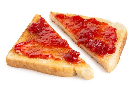 Two triangles of white toast spread with butter and strawberry jam isolated on white.の写真素材