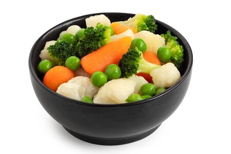 Mixed vegetables in black ceramic bowl isolated on white.の写真素材