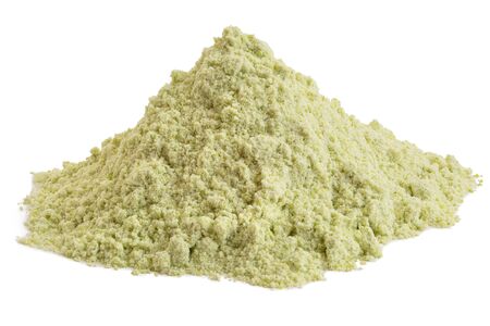 Heap of dried green pea flour isolated on white.の写真素材