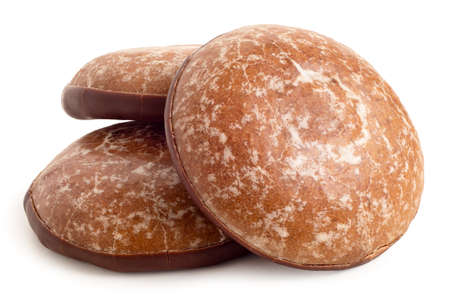 Three glazed gingerbread lebkuchens with chocolate isolated on white.の写真素材