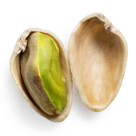 Single open pistachio isolated on white. Top view.の写真素材