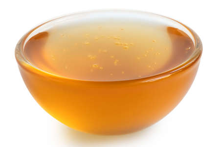 Chicory syrup in a glass dish isolated on white.の写真素材