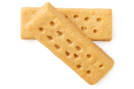 Two butter shortbread finger biscuits isolated on white. Top view.の写真素材