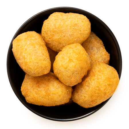 Fried breaded chilli cheese nuggets in a black ceramic bowl isolated on white. Top view.の写真素材