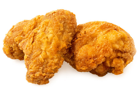 Crispy fried chicken pieces, drumstick and wing, isolated on white.の写真素材