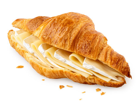 Cheese croissant filled with edam and brie slices isolated on white. Crumbs.の写真素材
