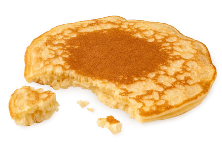Pancake isolated on white. Partially eaten with crumbs. No topping.の写真素材