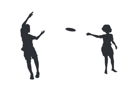 Children playing flying disc. Black isolated silhouette of kids relaxing outdoors. Happy childhood scene. Park summer activity. Girl and boy with discのイラスト素材