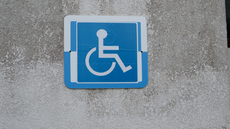 Disabled parking sign on the streetの写真素材
