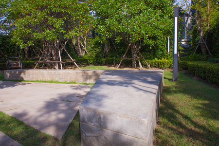 Stone bench in green garden at thailandの写真素材
