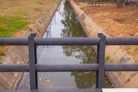 Concrete bridge over water in the parkの写真素材