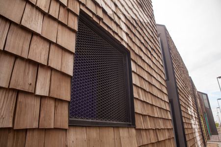 Window and wooden blocks stacked as wallの写真素材