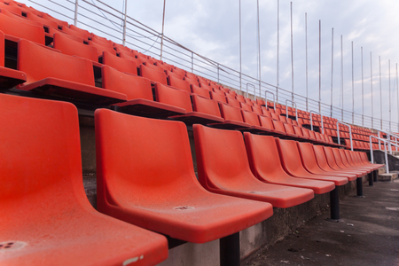 orange seat of football stadium in thailandの写真素材