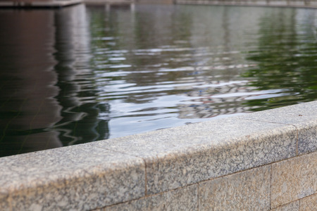 Reflection of pool outside modern buildingの写真素材