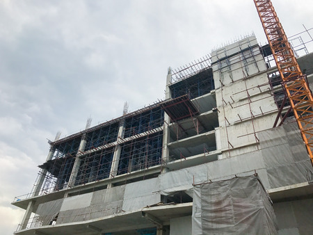 crane and Under construction building in thailandの写真素材