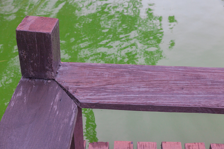 outdoor Wood bench near the river at thailandの写真素材