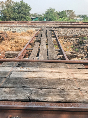 dirty Old wooden bridge cross the roadの写真素材